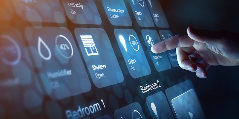 A hand touches a digital touchscreen displaying smart home controls, highlighting the benefits and internet of things privacy considerations when managing lights, shutters, fan, and other connected devices with intuitive interface options.