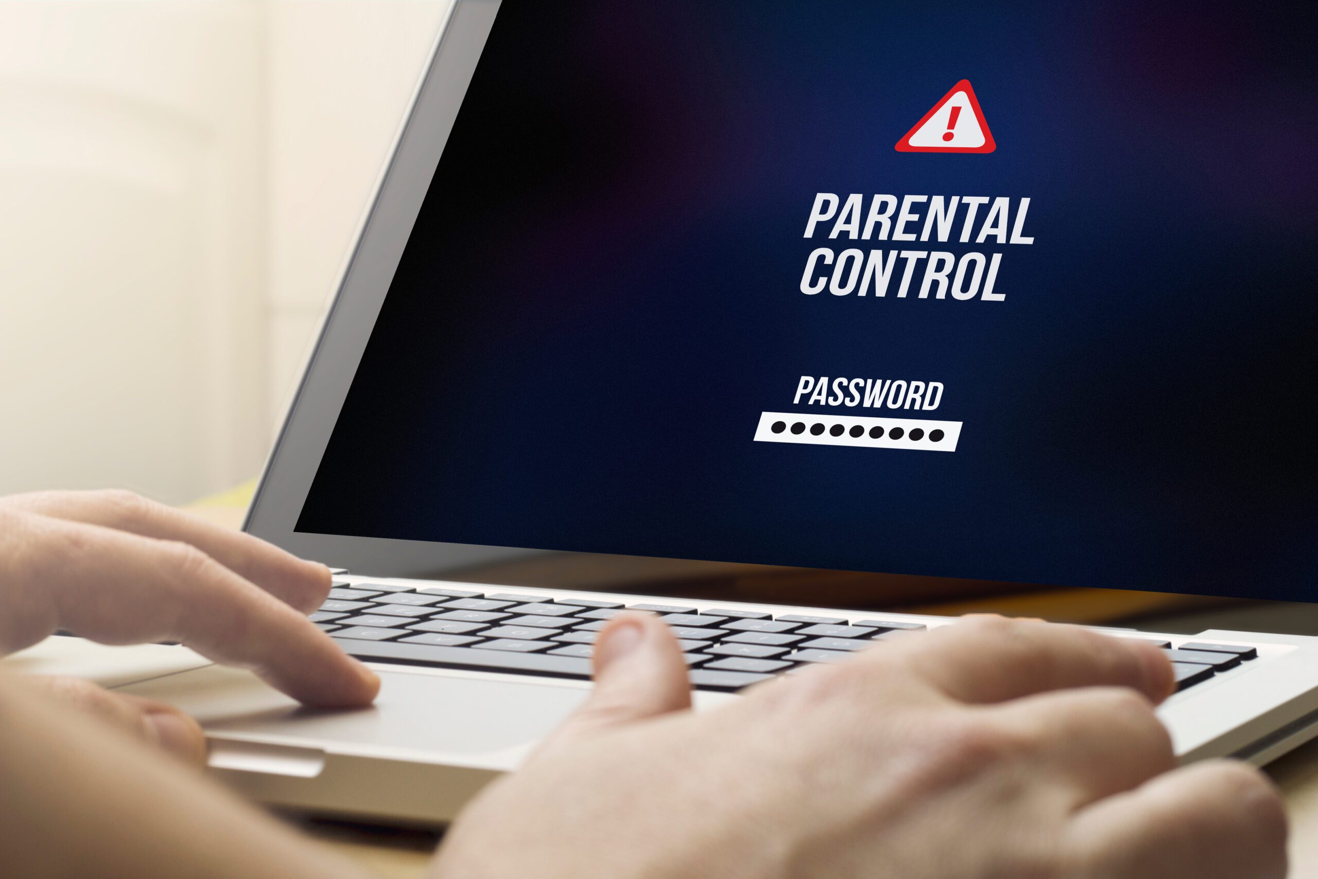 A person is using a laptop displaying a "parental control" login screen, asking for a password, symbolized by an alert icon. hands are shown typing on the keyboard.