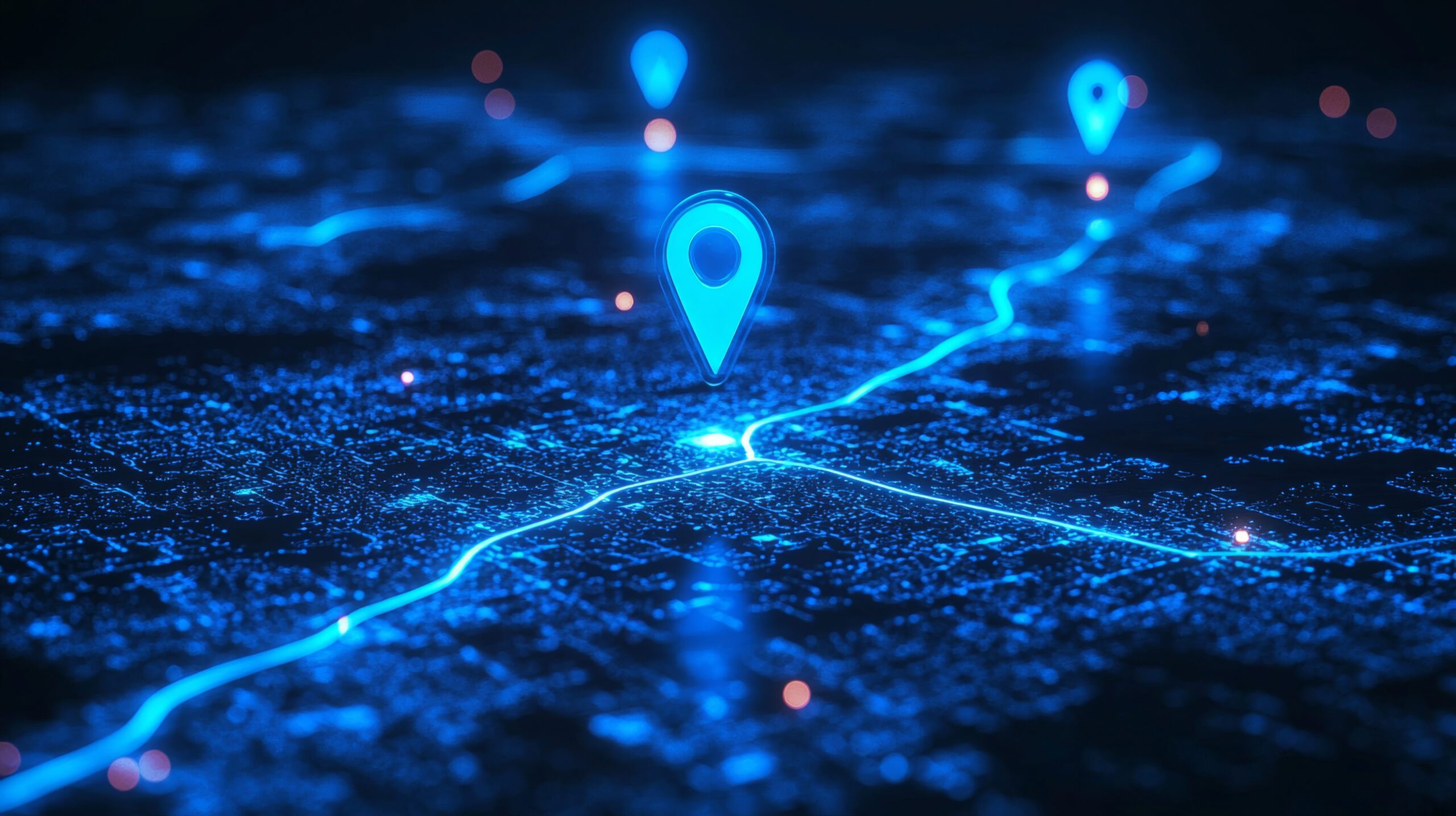 A digital map with glowing blue lines and several large, illuminated location pins, representing GPS or navigation technology on a dark background.